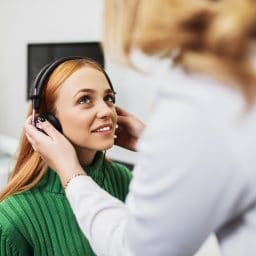 Woman gets a hearing test.